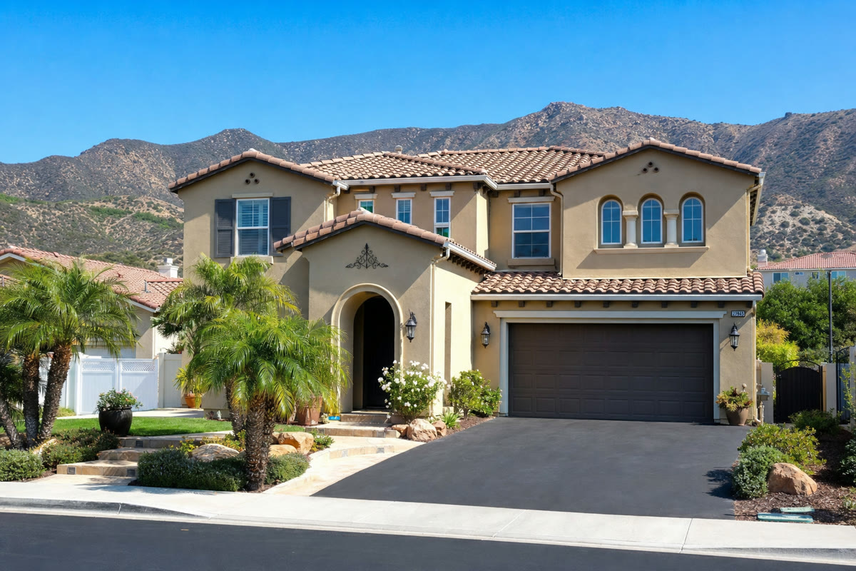 Mediterranean-style two-story home in Santa Clarita Valley with mountain backdrop